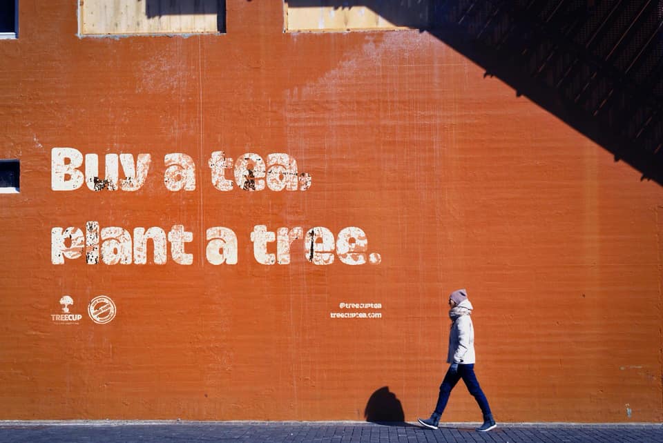 Buy A Tea, Plant A Tree spraypainted